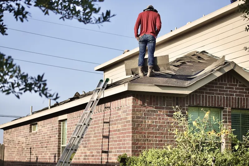 Professional roofer working on a residential roof in Myrtletown
